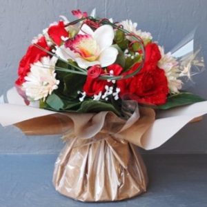 Pompes funèbres Grosso : Bouquet bulle gerberas orchidées fleurs diverses rouge 35cm(hauteur)x32cm(largeur)
